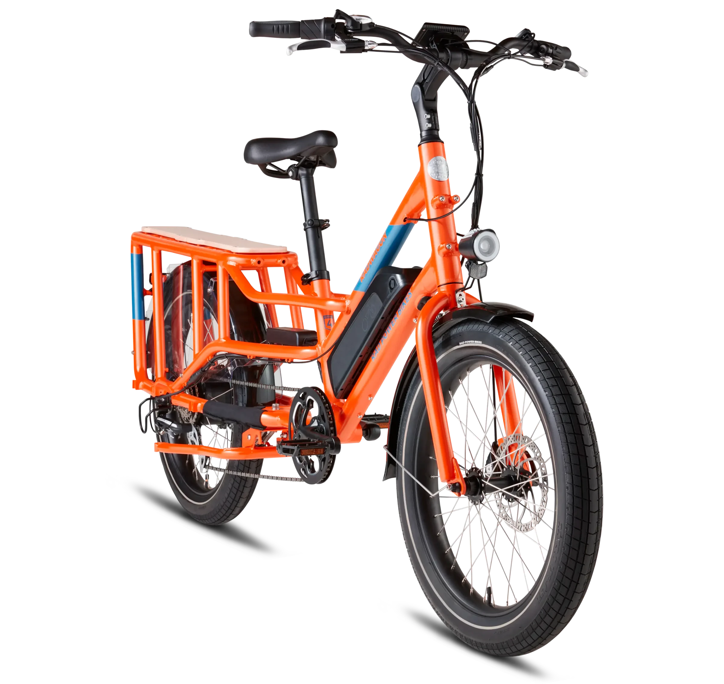 An orange Rad cargo ebike with fat tires and a front rack