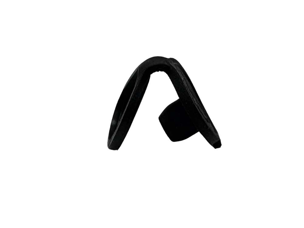 A curved black charge port cover